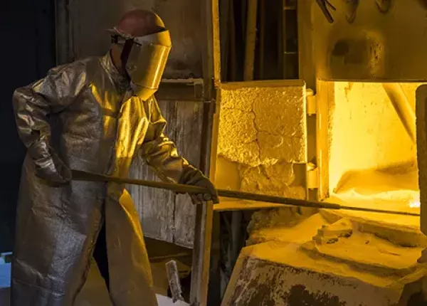 A technician tends to the furnace.