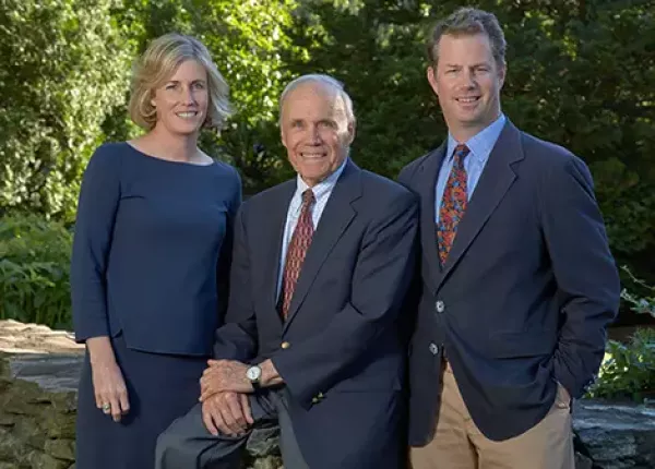 Photo of the Williams family, left to right: Anne Williams, Peter Williams, Tim Williams